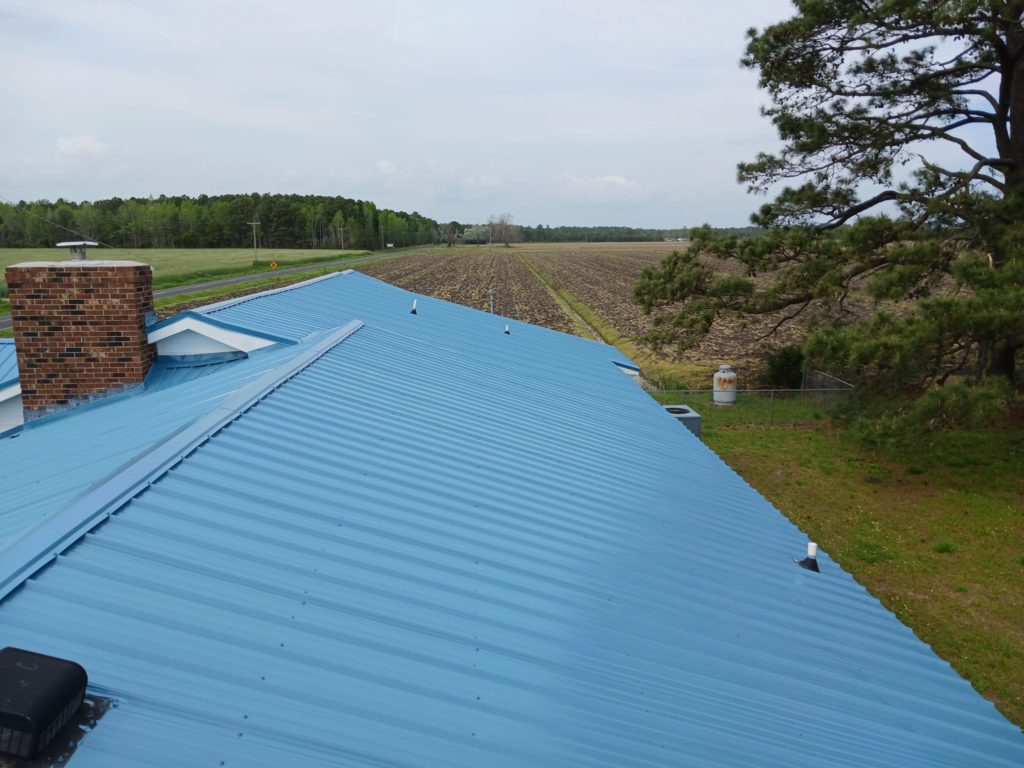 A light blue metal roof was installed on a residential property.
