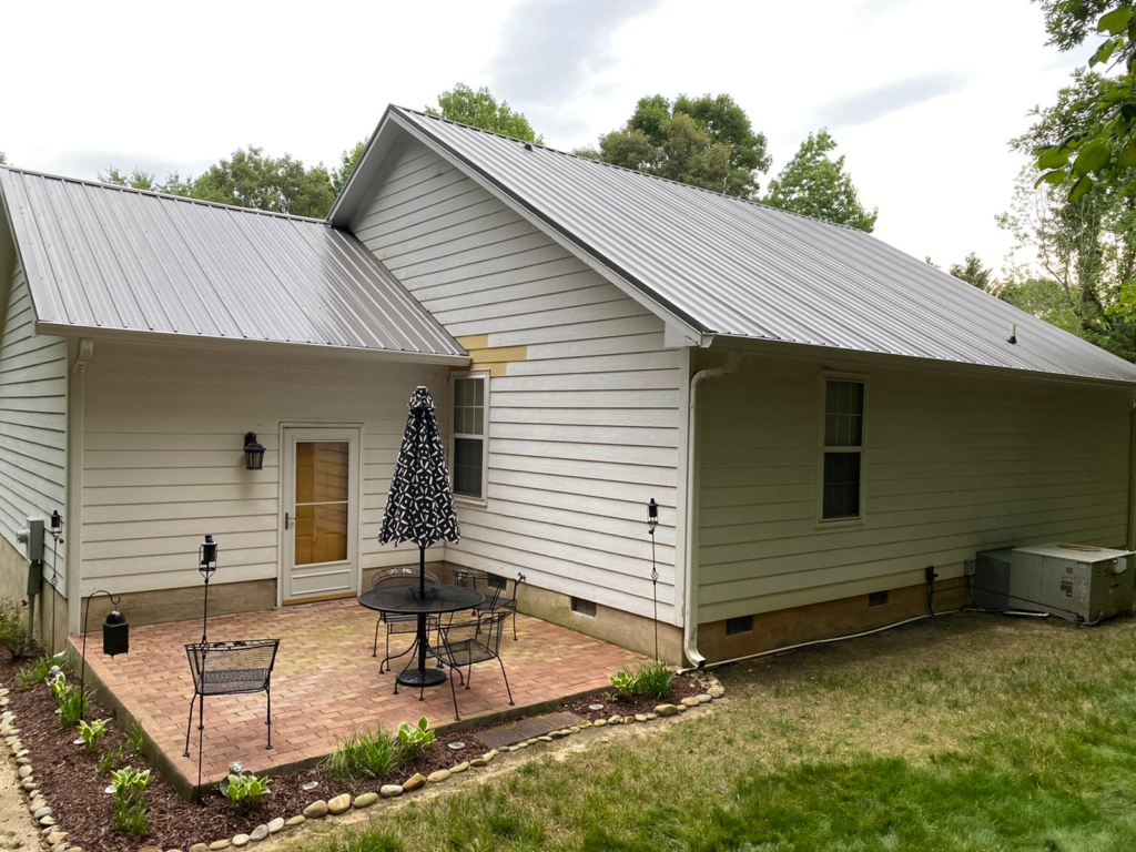 A tan metal roof was installed on a residential property.